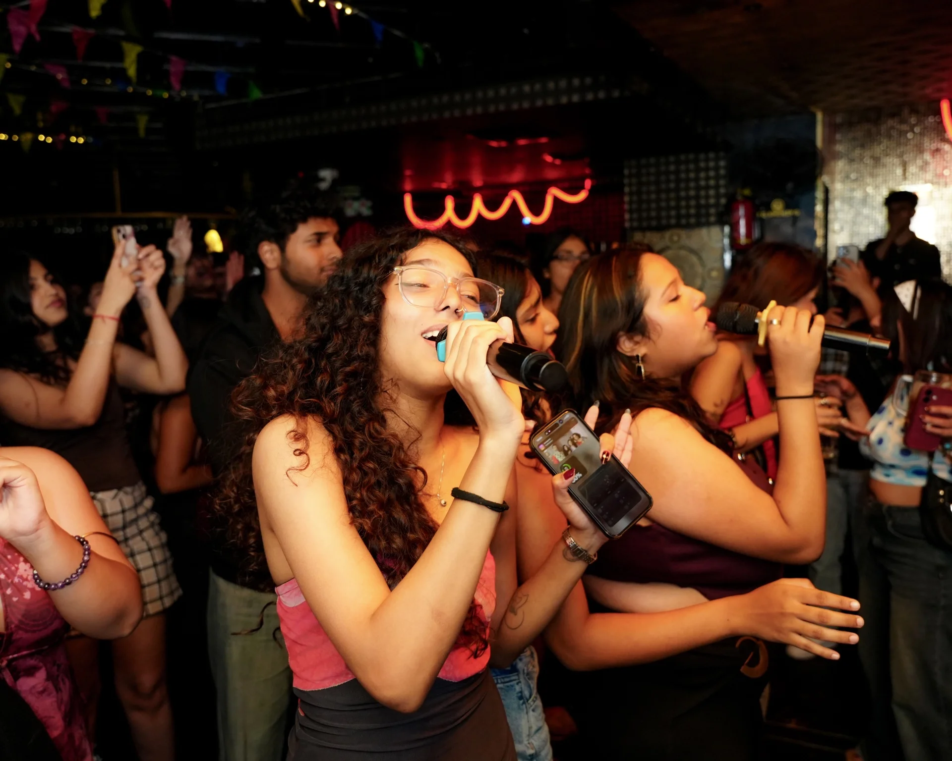 Crowd singing at House Party karaoke night